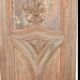 Paneled and carved wooden cupboard door