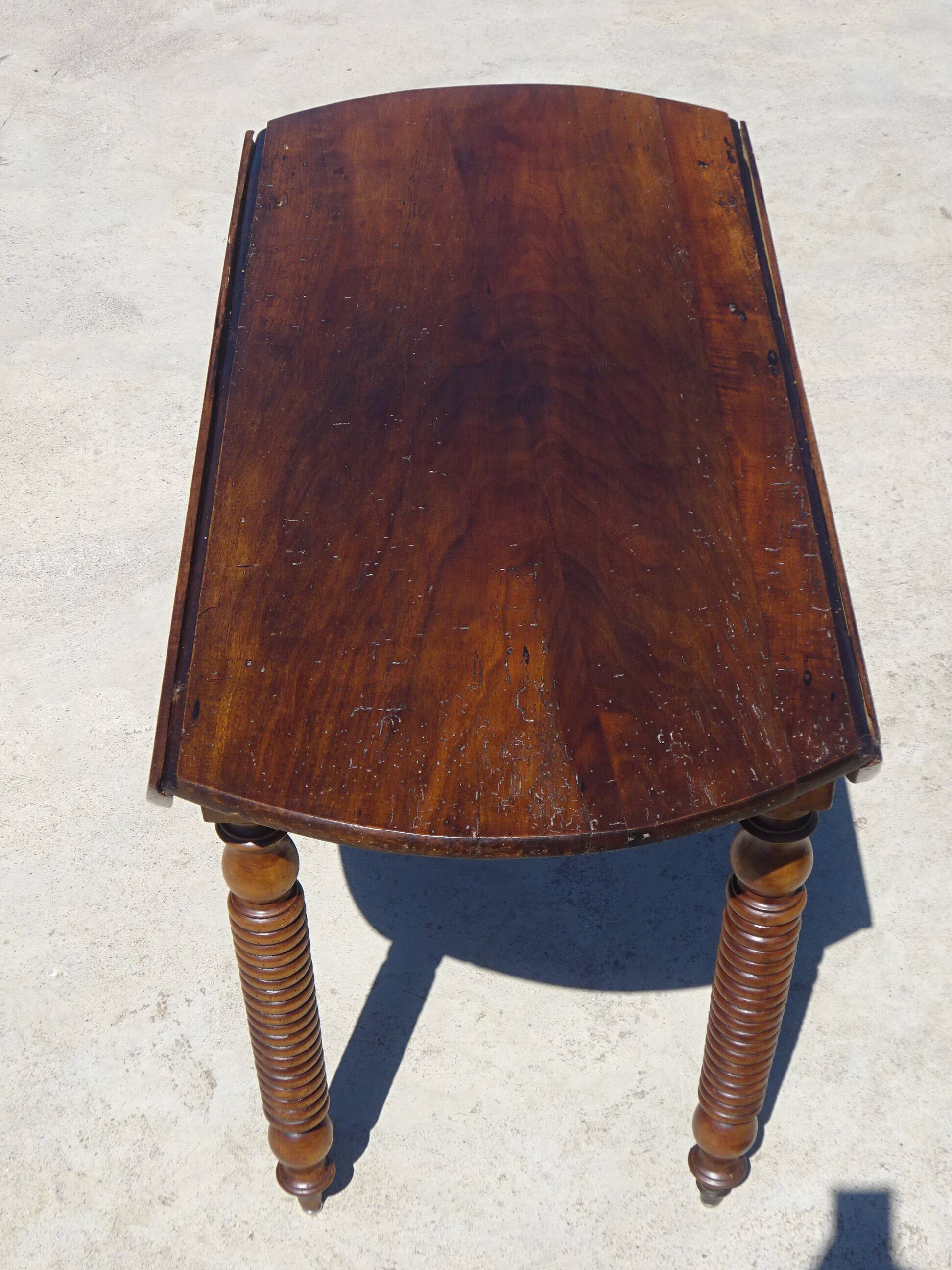 Antique walnut console table with honey spoon legs.