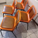 Chairs orange plastic shells seats and backrests imitation leather