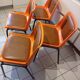 Chairs orange plastic shells seats and backrests imitation leather