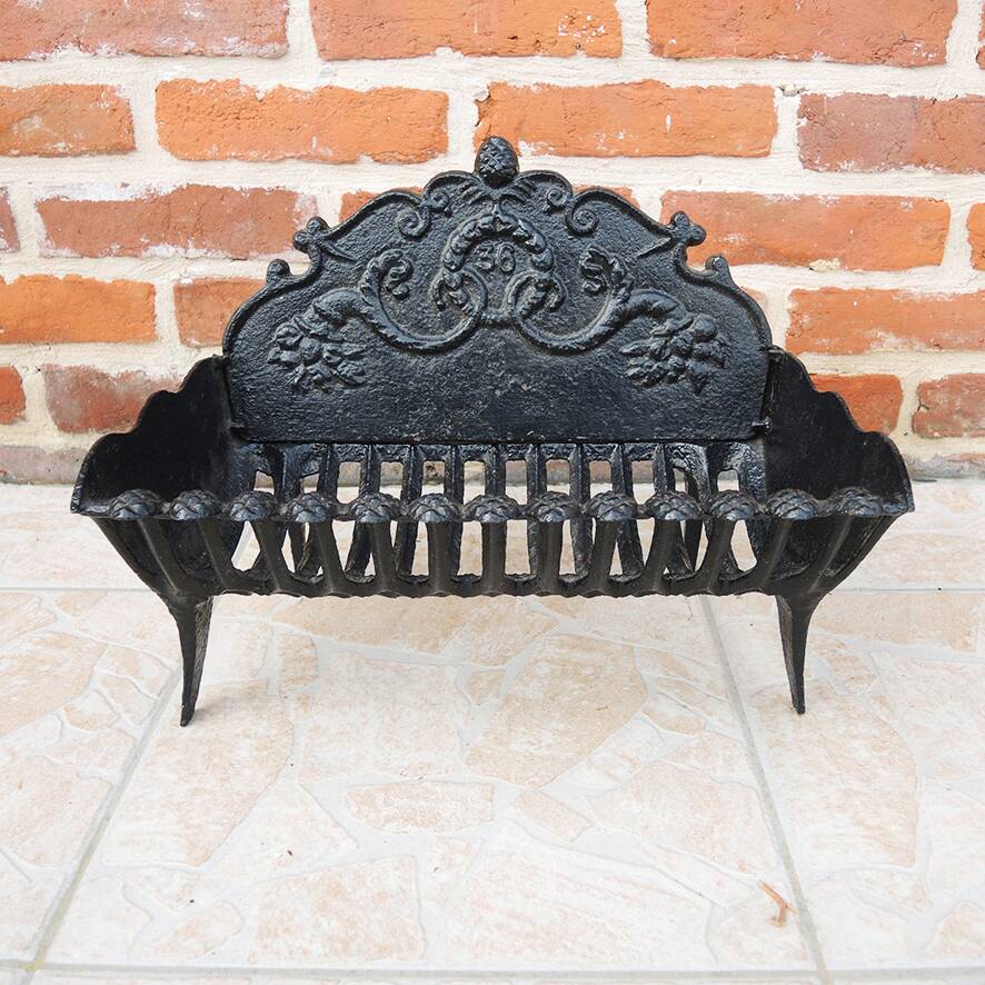 Old cast iron log cradle with backrest