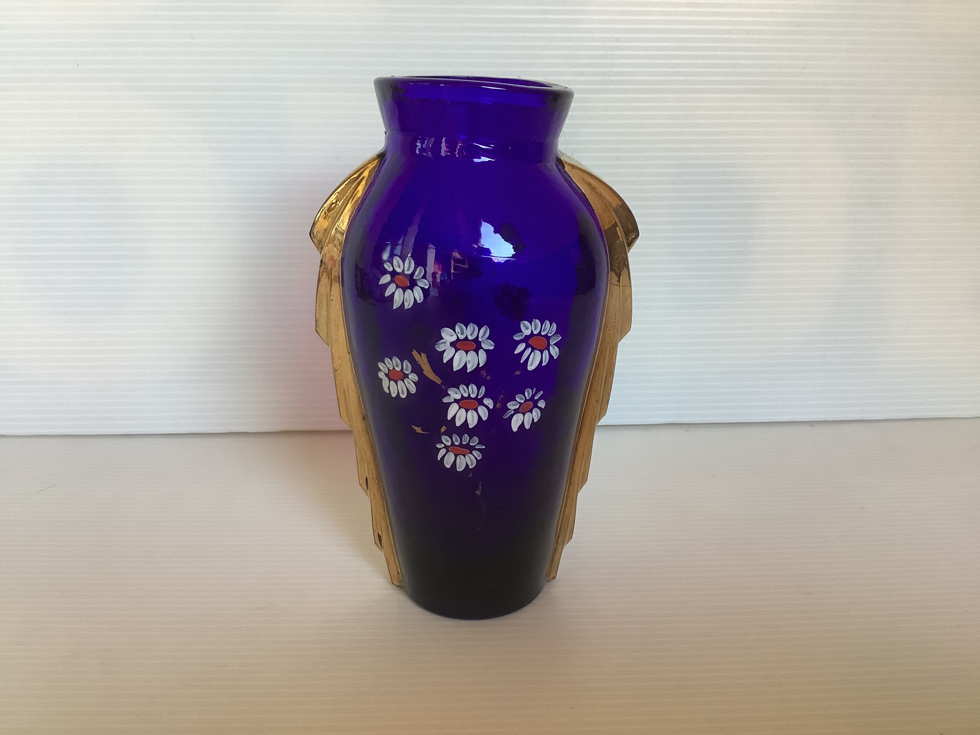Antique blue and gold glass vase with flower pattern