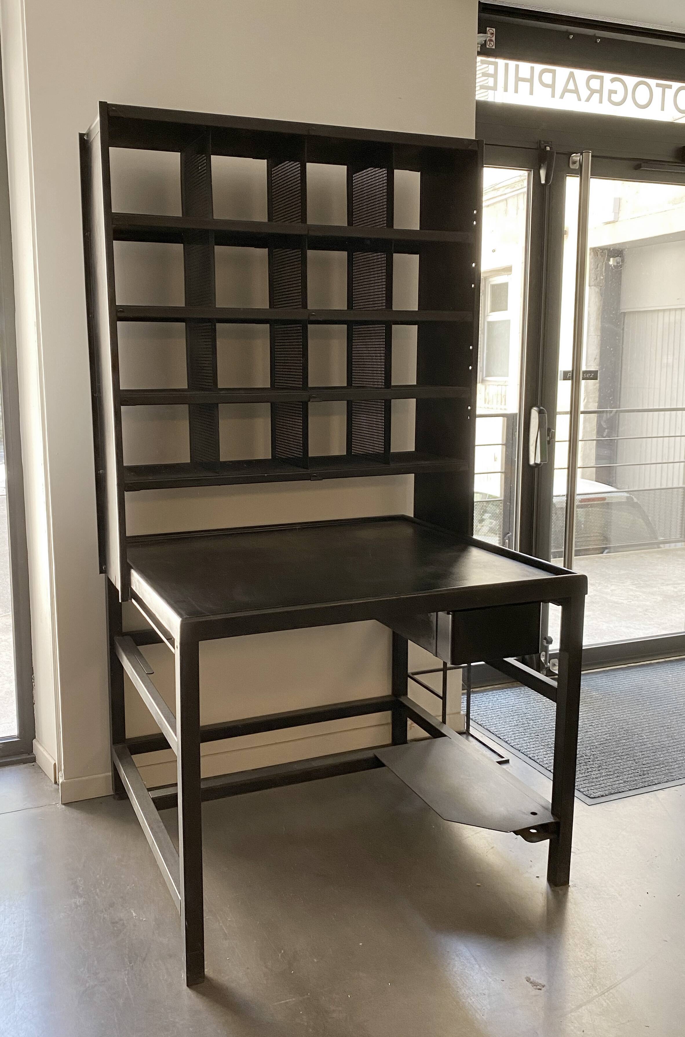 Postal sorting desk with a sliding top part back and forth.
