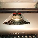 Machine à ecrire remington portable 50's  portable avec sa boite originale coloris gris