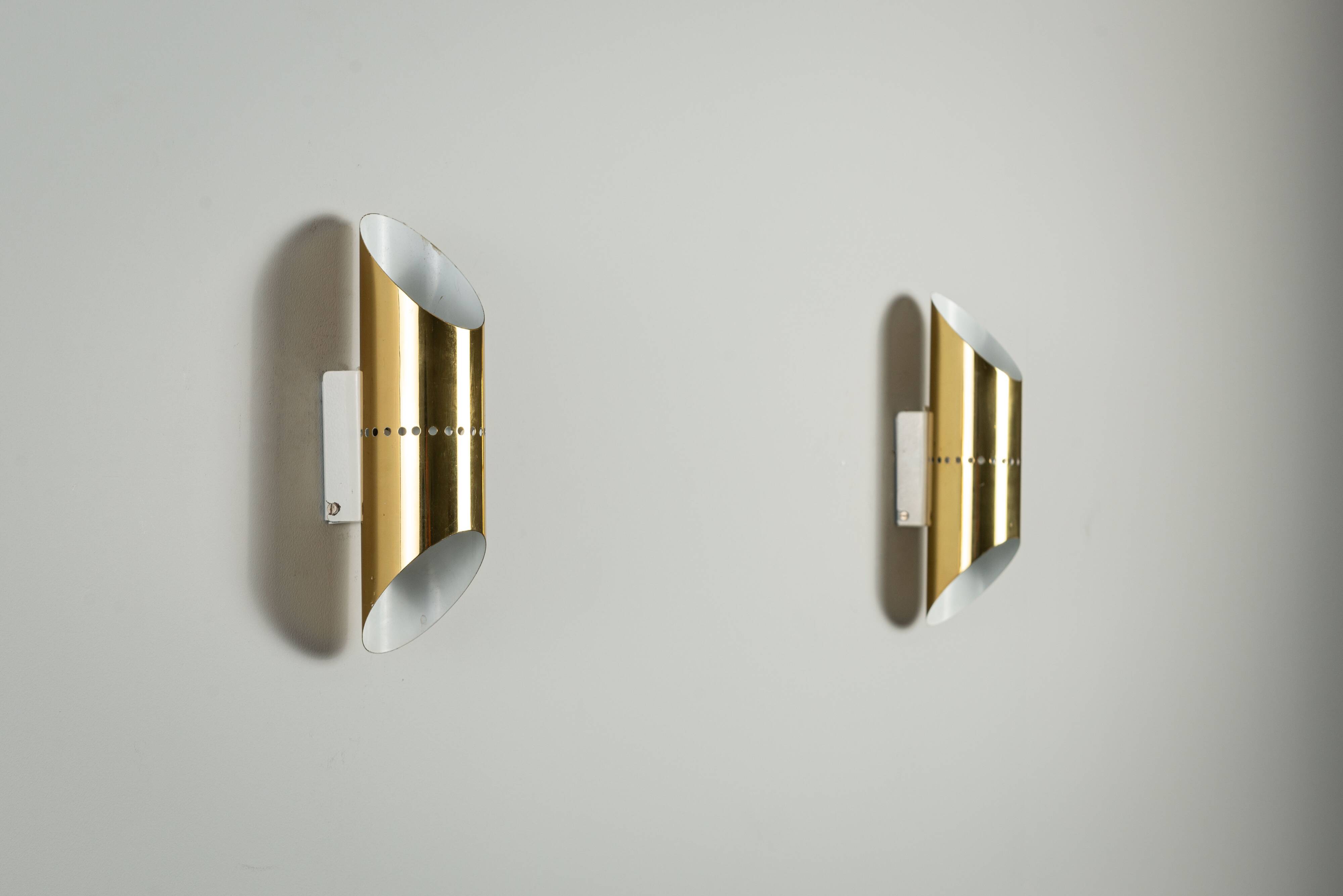 Pair of cylindrical wall lamps in brass with perforated shades