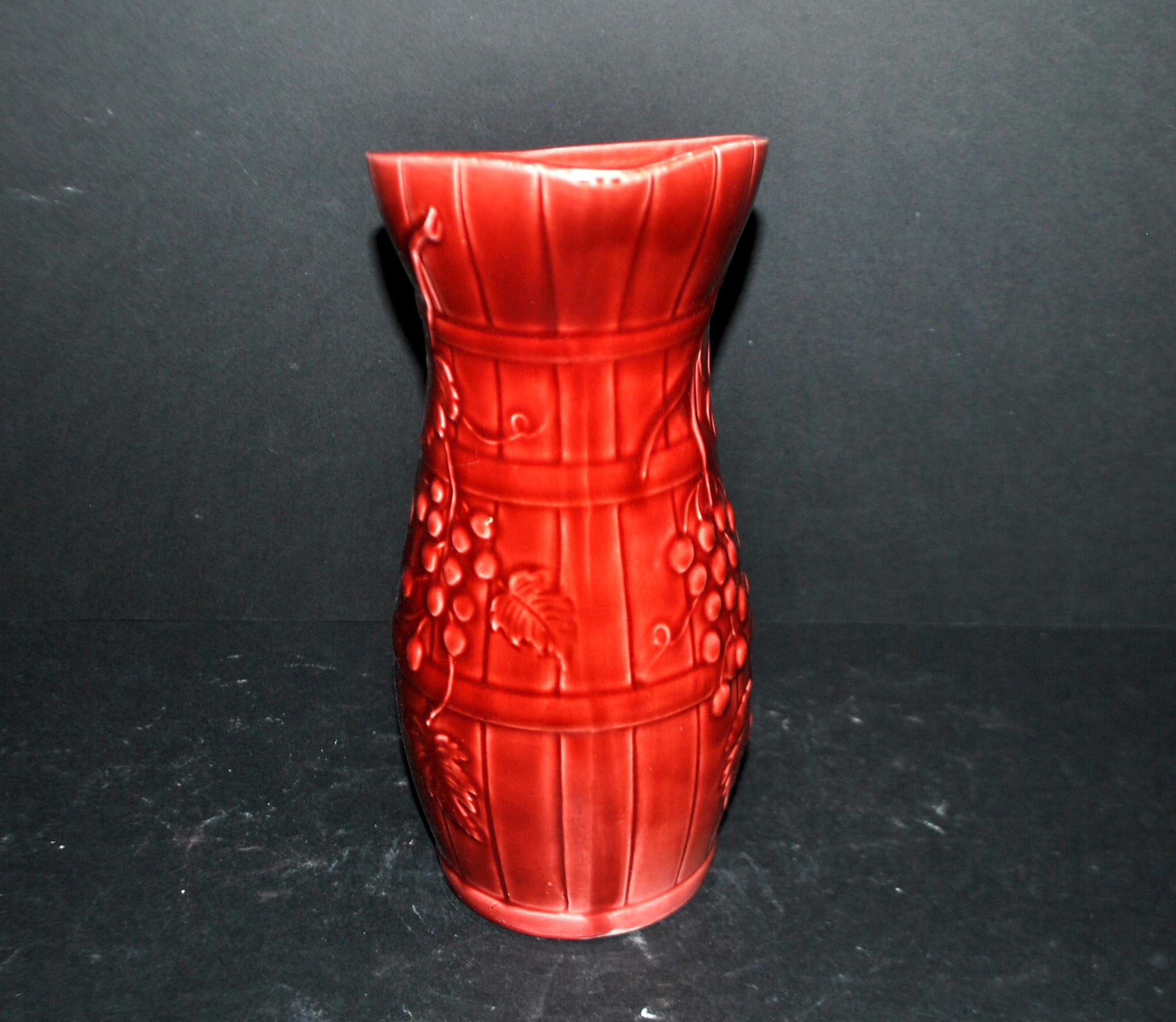 Sarreguemines wine jug in red slipware with grapevine decoration.