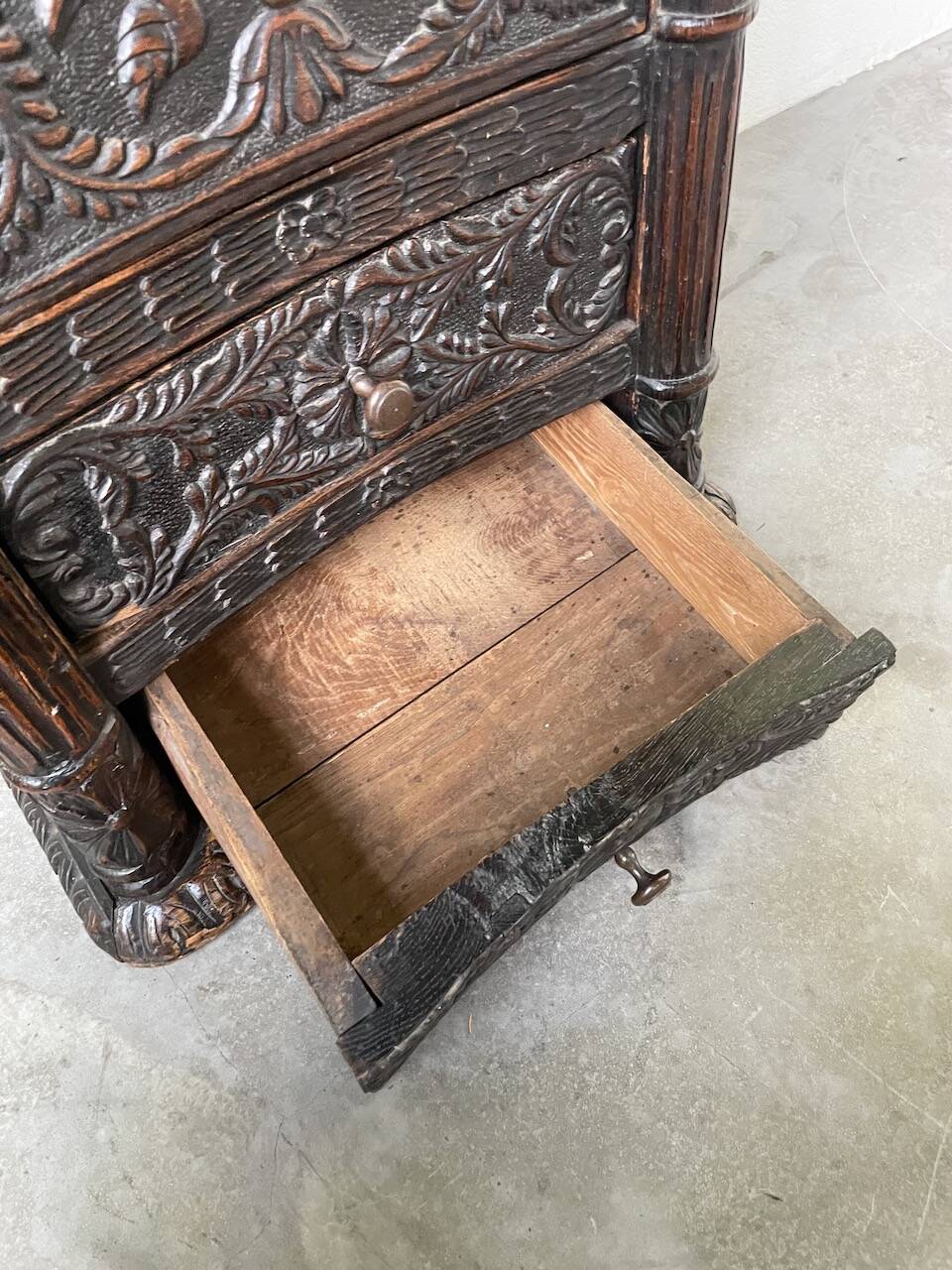 19th century chest of drawers in carved blackened pine