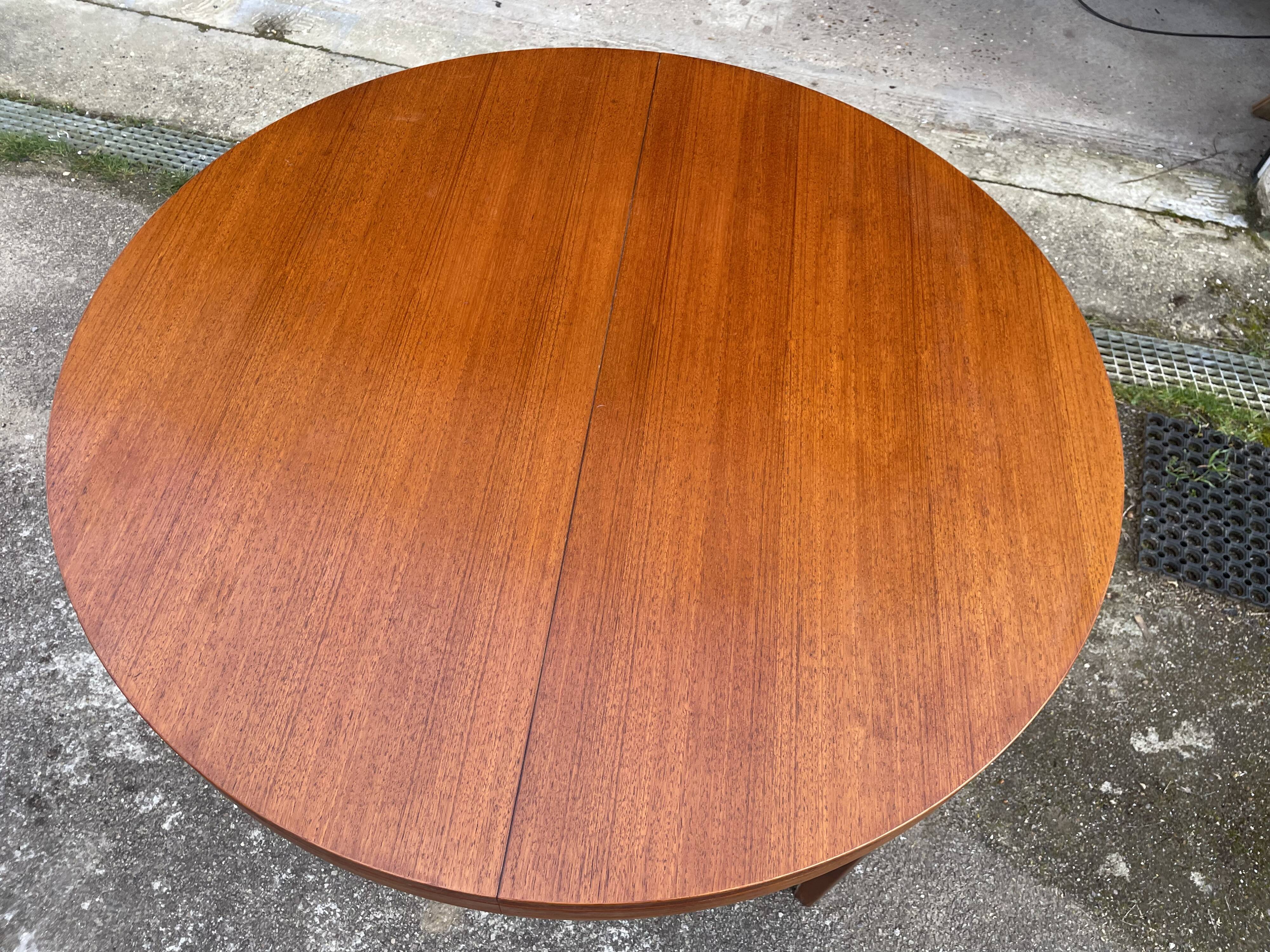Round teak dining table