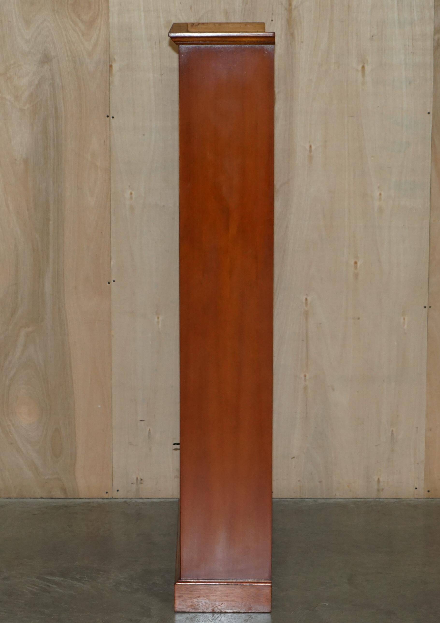 Open library Bradley Furniture made of yew wood with a cupboard base.