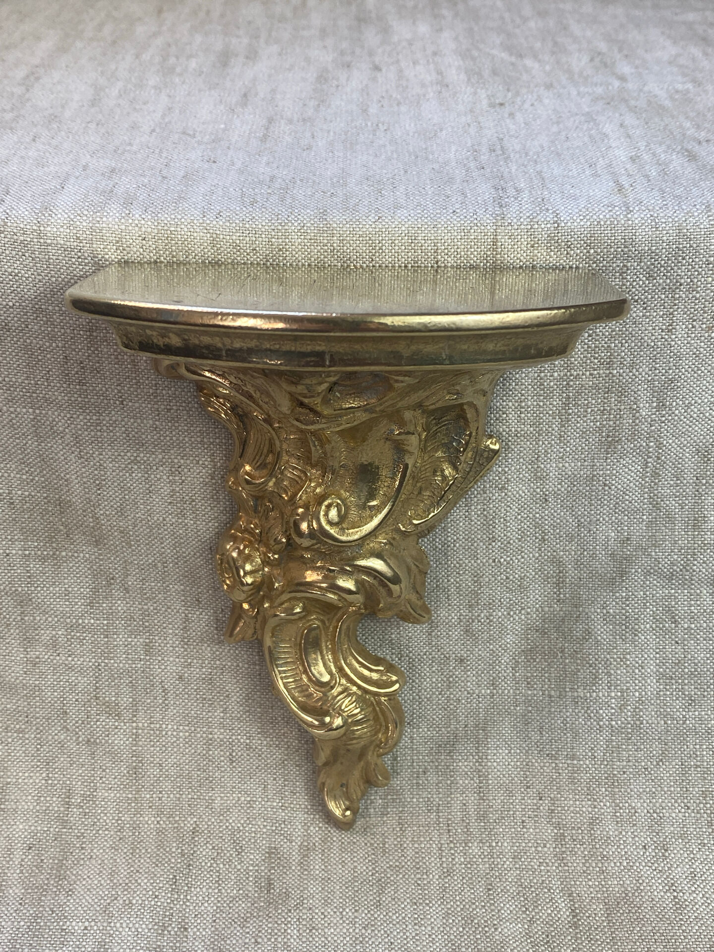Small wall console in Rococo style in bronze