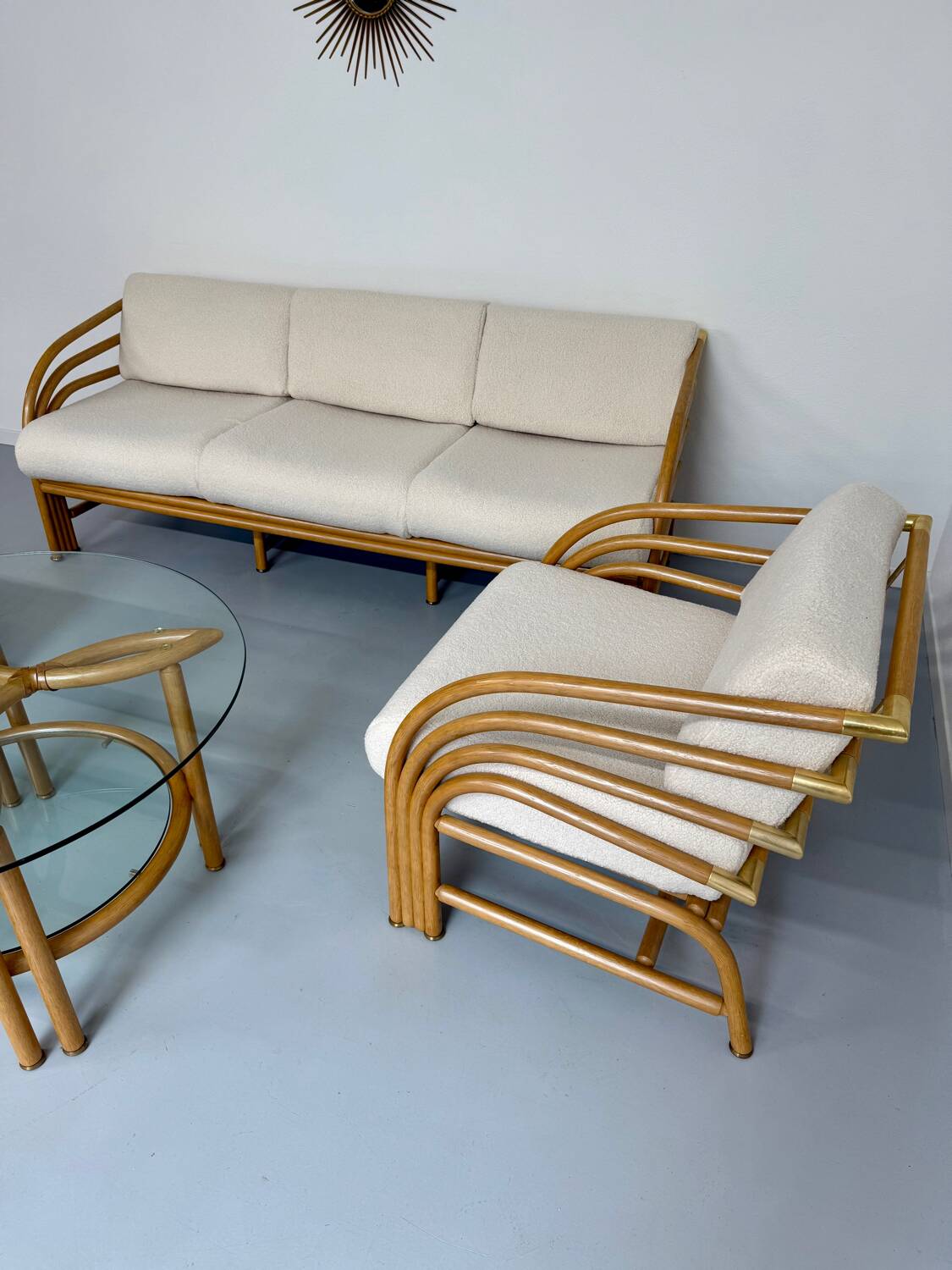 Complete living room with rattan sofa and white bouclette, brass finish, 80's design