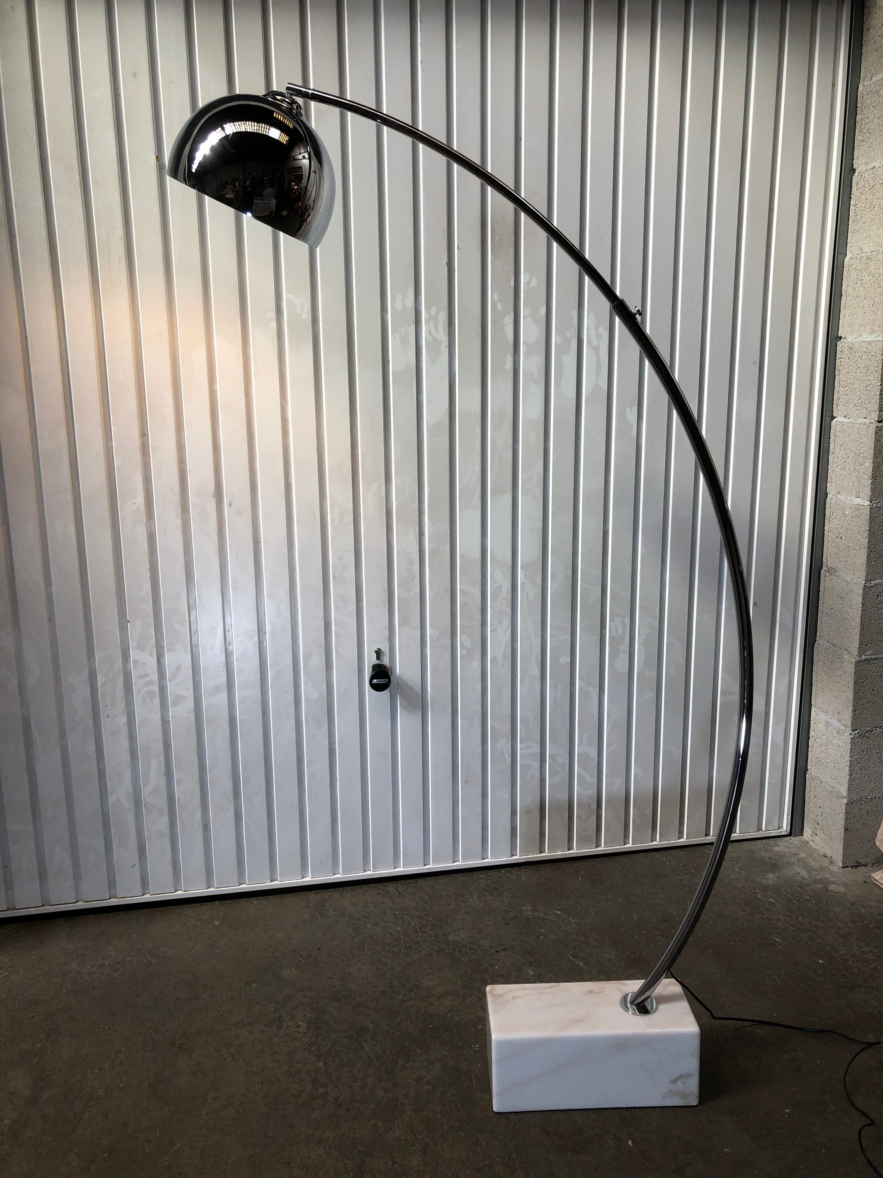 Arc floor lamp design of the 80s