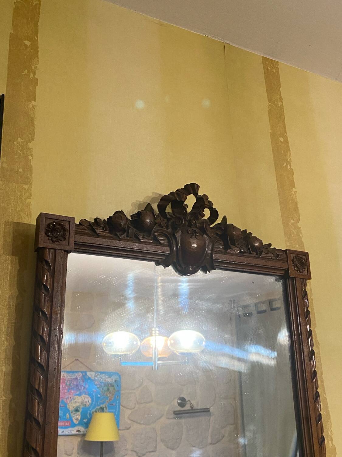 Carved wooden mirror in Louis XVI style