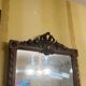 Carved wooden mirror in Louis XVI style