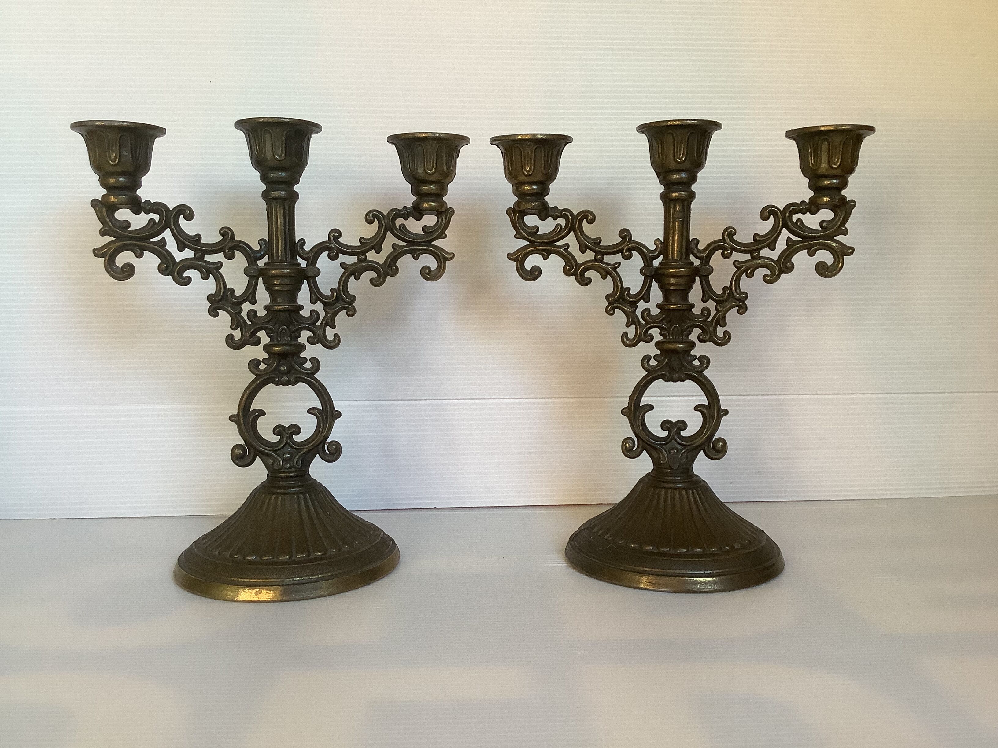 Pair of baroque brass candle holders