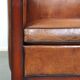 Sheepskin Art Deco design armchair with wood and beautiful cognac-colored leather