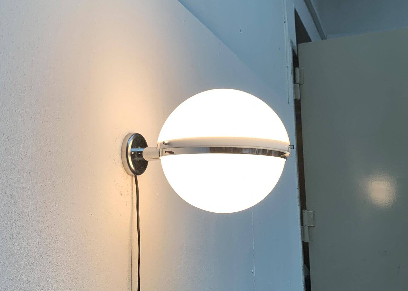 Mid-century Italian space age spherical wall light by Guzzini.