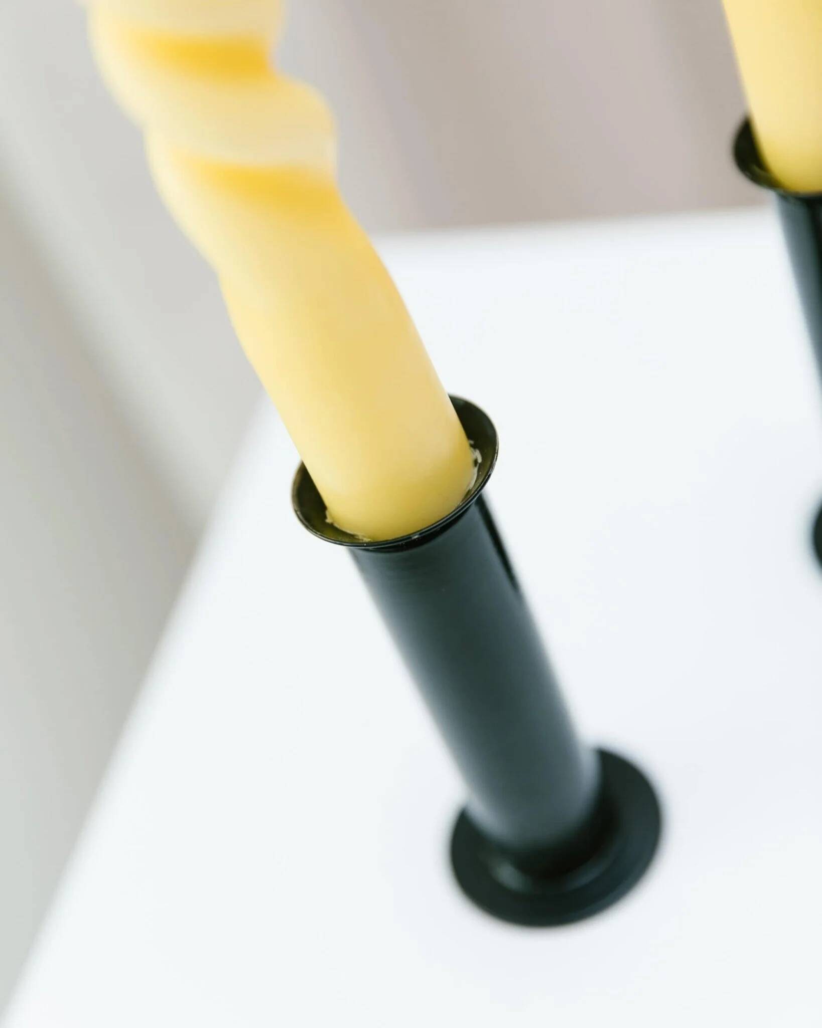 Set of 2 glossy black metal candleholders in retro Ikea Memphis style