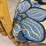 Vintage armchair in rattan and floral fabric