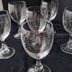 6 vintage wine glasses with baluster stems and engraved decoration on the bowl.