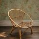 Vintage 1960s rattan shell chair – an icon of bohemian design.