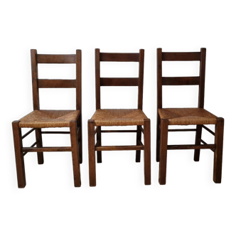 Lot of old brutalist straw chairs in solid wood