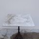 Bistro pedestal table in marble and cast iron lion paws
