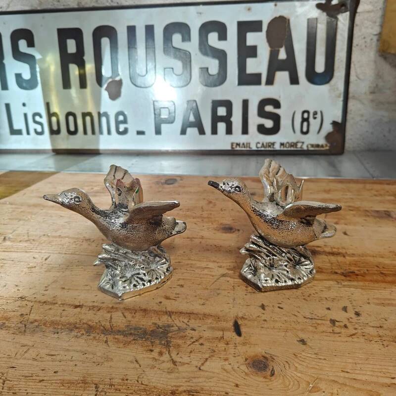 Set of two vintage silver-plated candle holders.