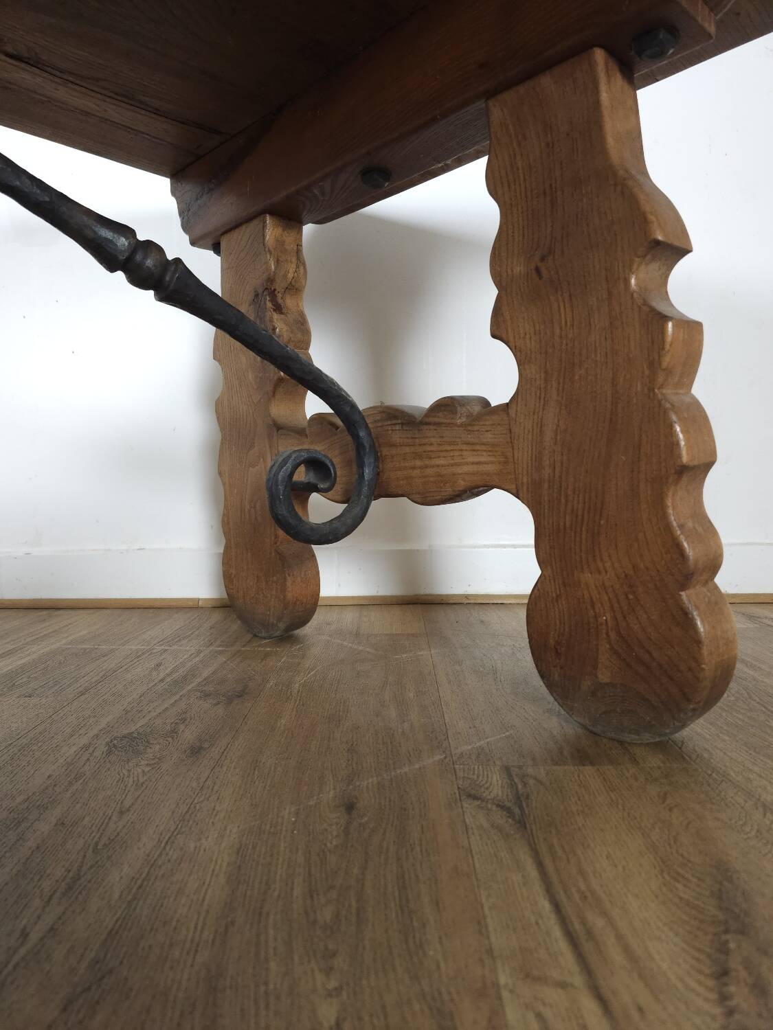 Rustic solid oak table with wrought iron, circa 1950.