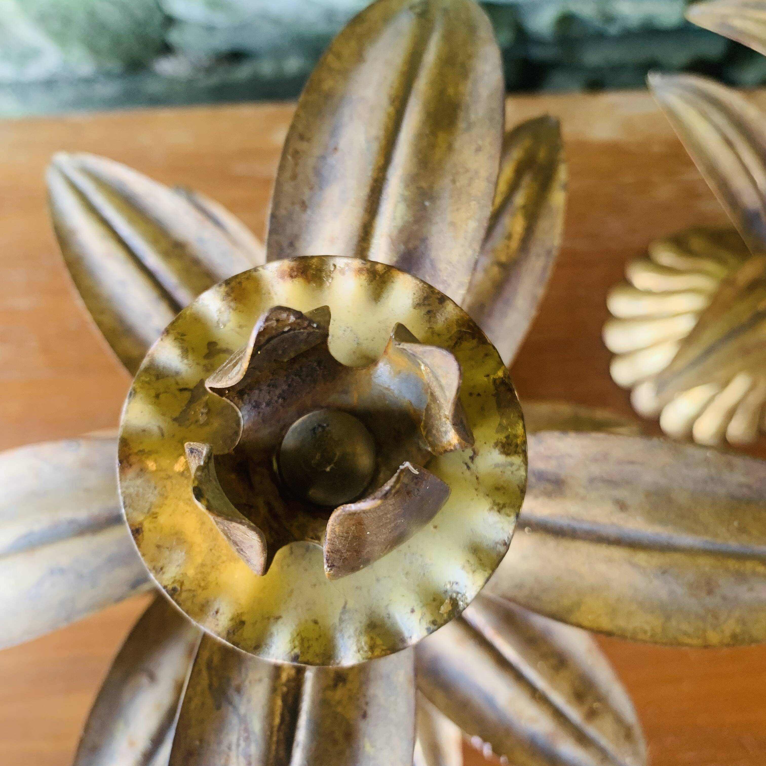 Pair of candlesticks with golden leaves from the 1960s.