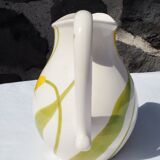 Pitcher with yellow flowers
