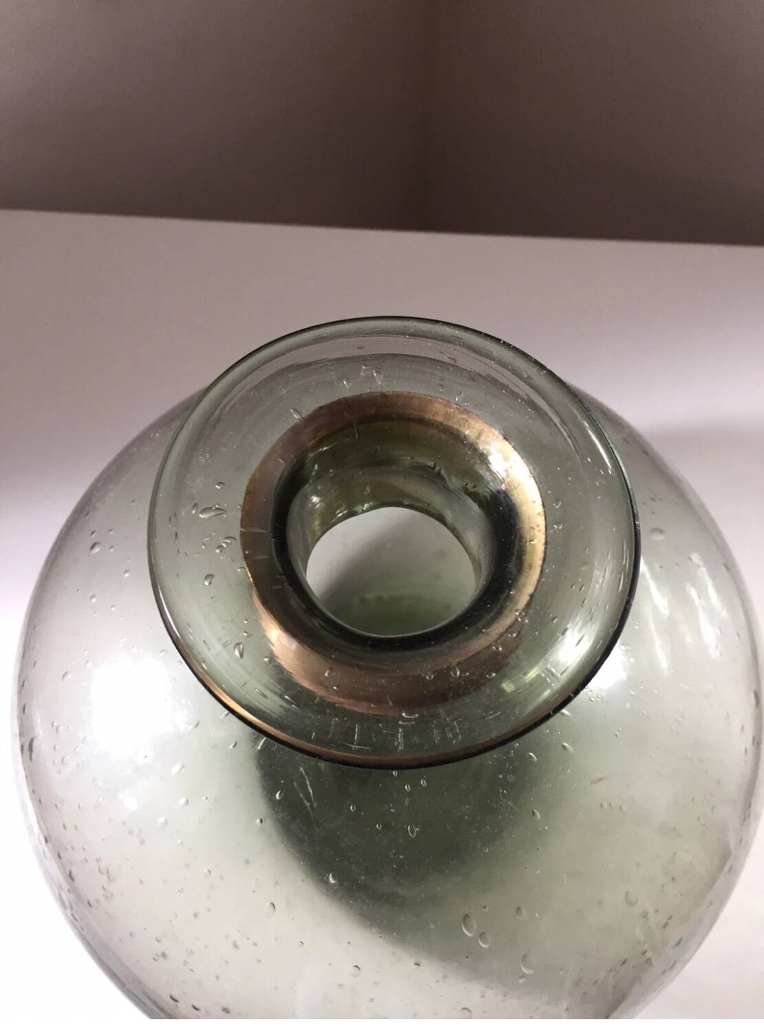 Vintage bubble glass ball vase with brass rim