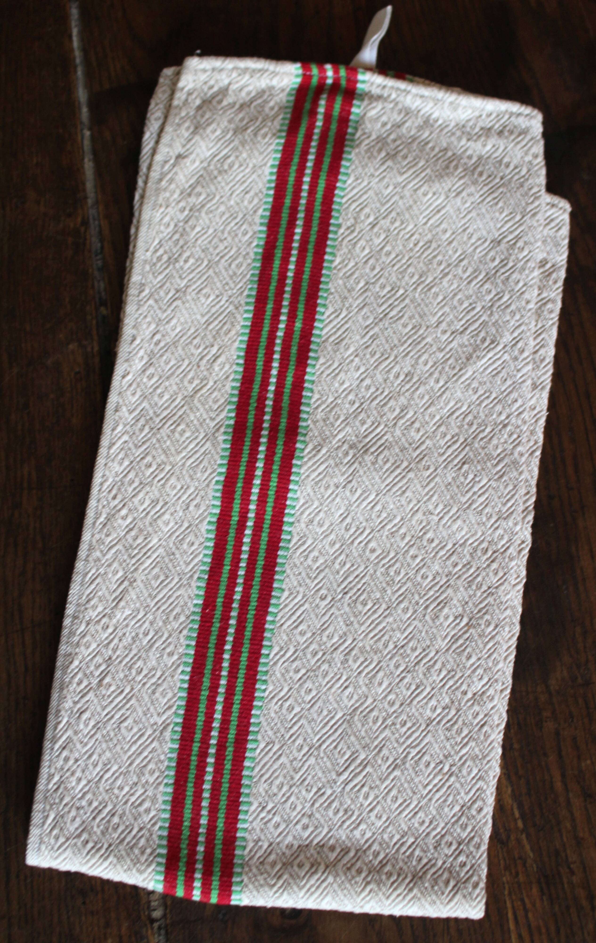 Old chevron towel with red and green stripes.