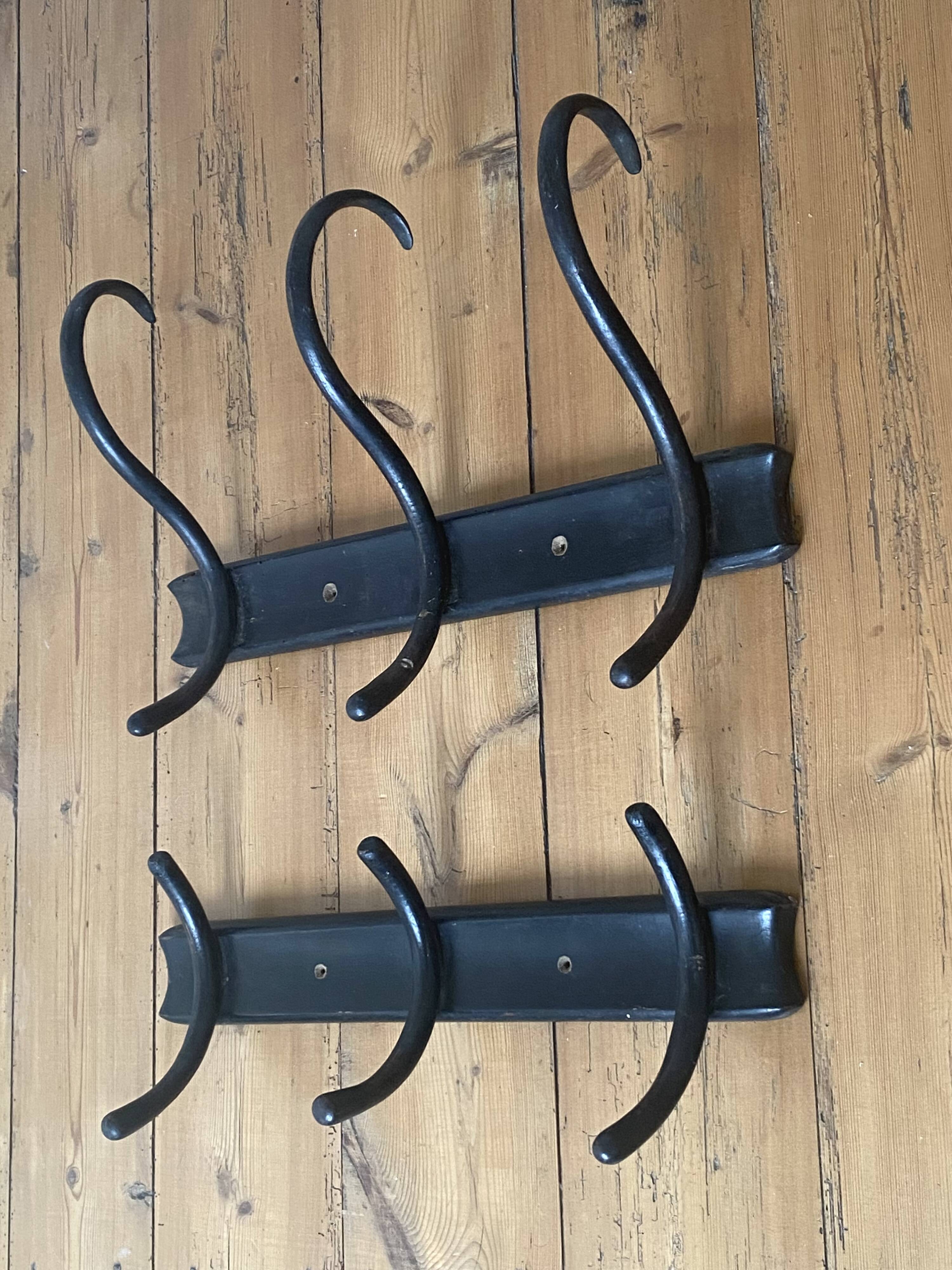 Old black curved wooden coat rack