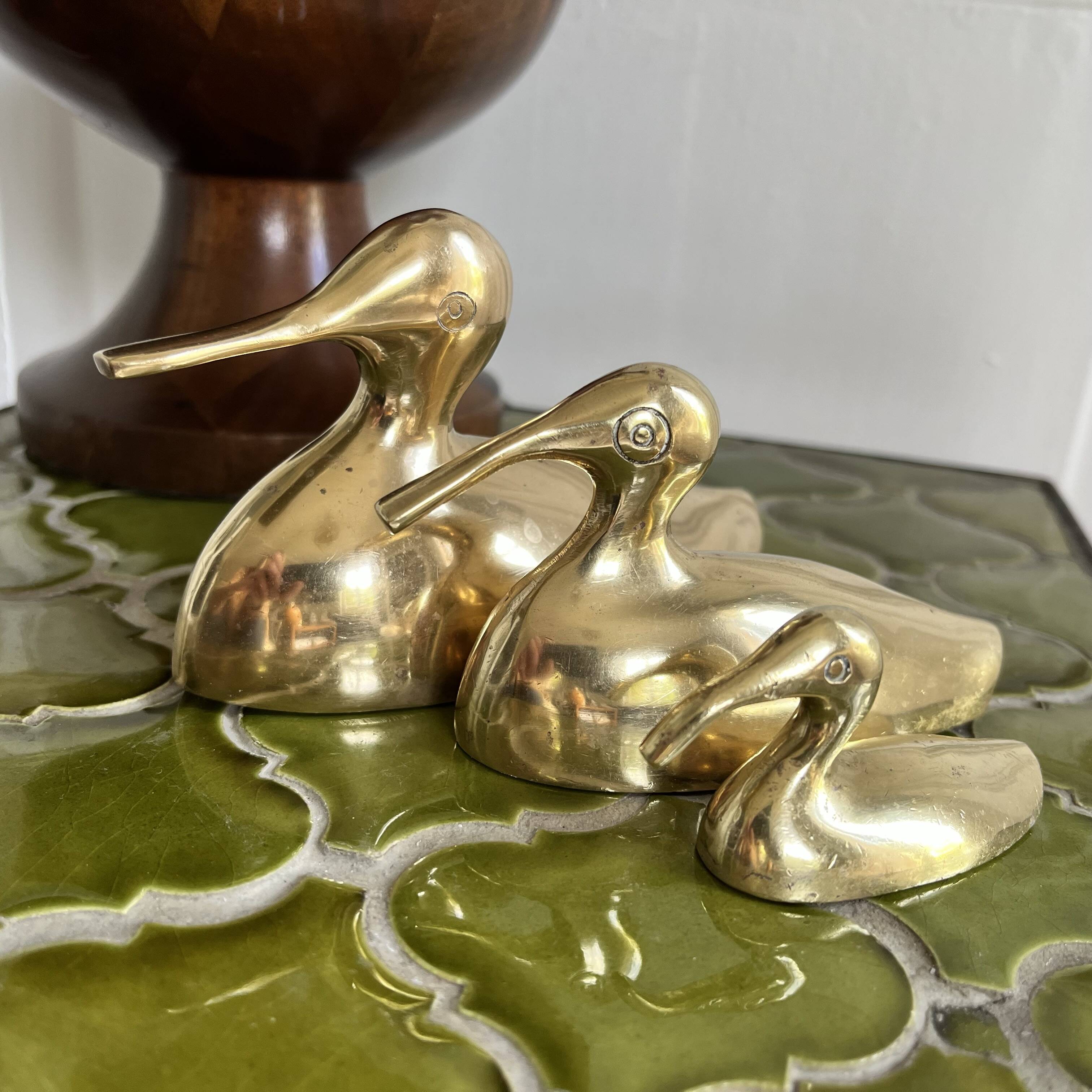 Three brass ducks from the 1950s