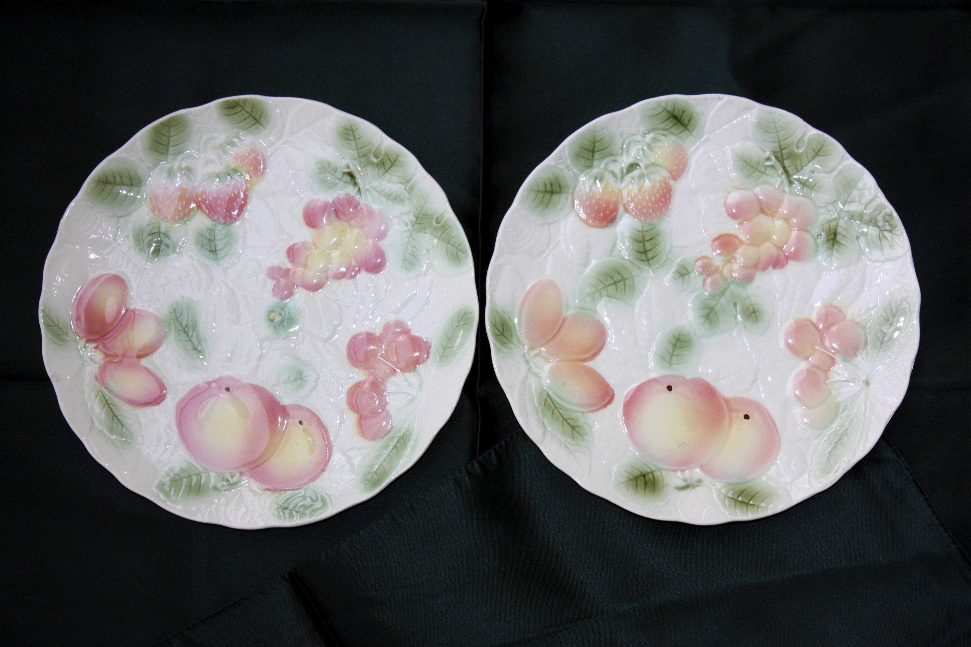 Two slip plates decorated with fruit.