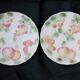Two slip plates decorated with fruit.
