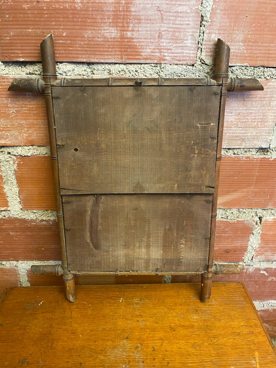 Antique mercury mirror with wooden frame and bamboo style vintage