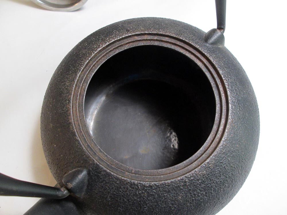 Black cast iron teapot