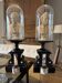 Pair of busts of Bellini and Puccini under a glass dome.