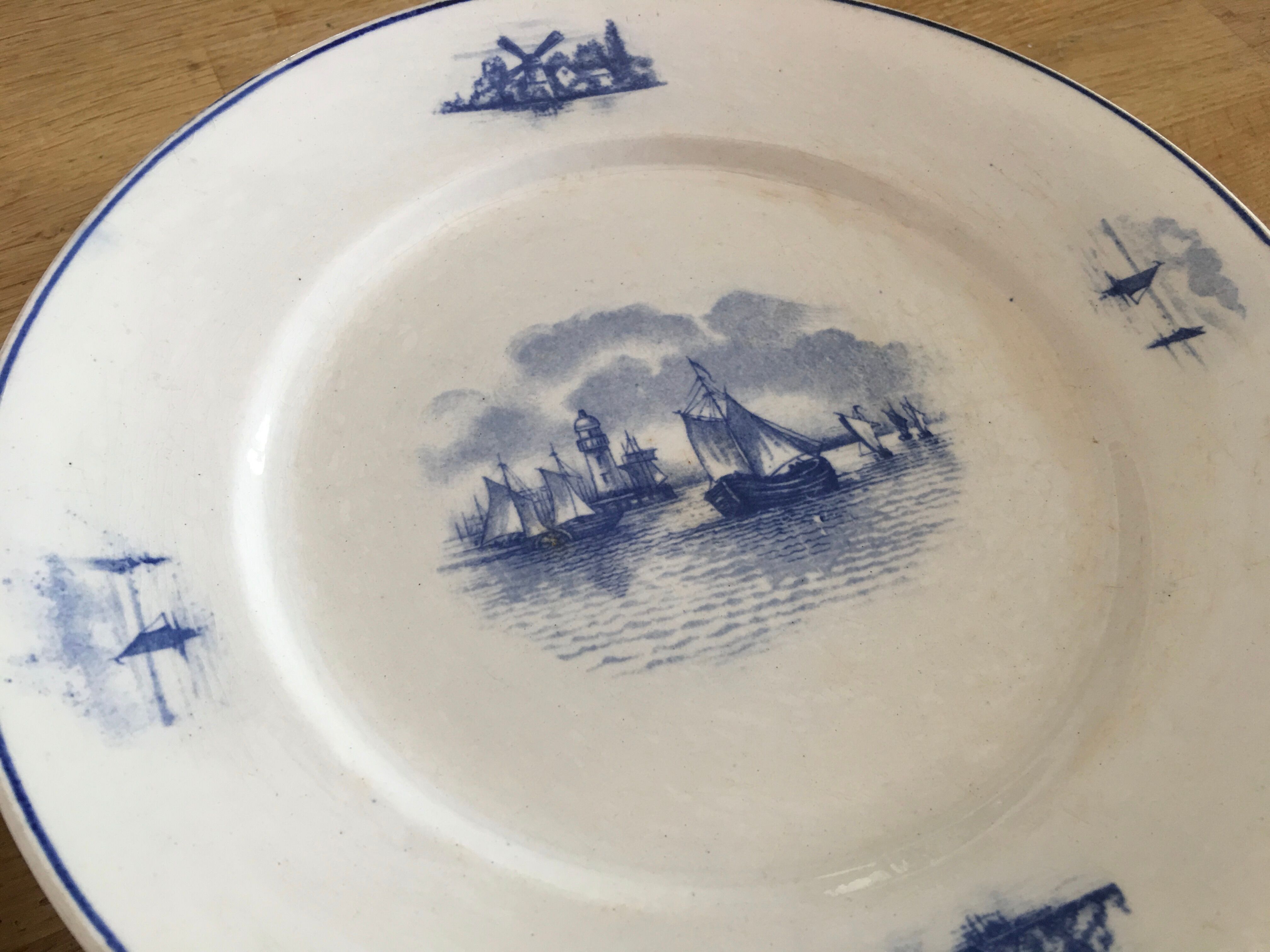 Series of 11 flat plates, Dutch earthenware, early XX