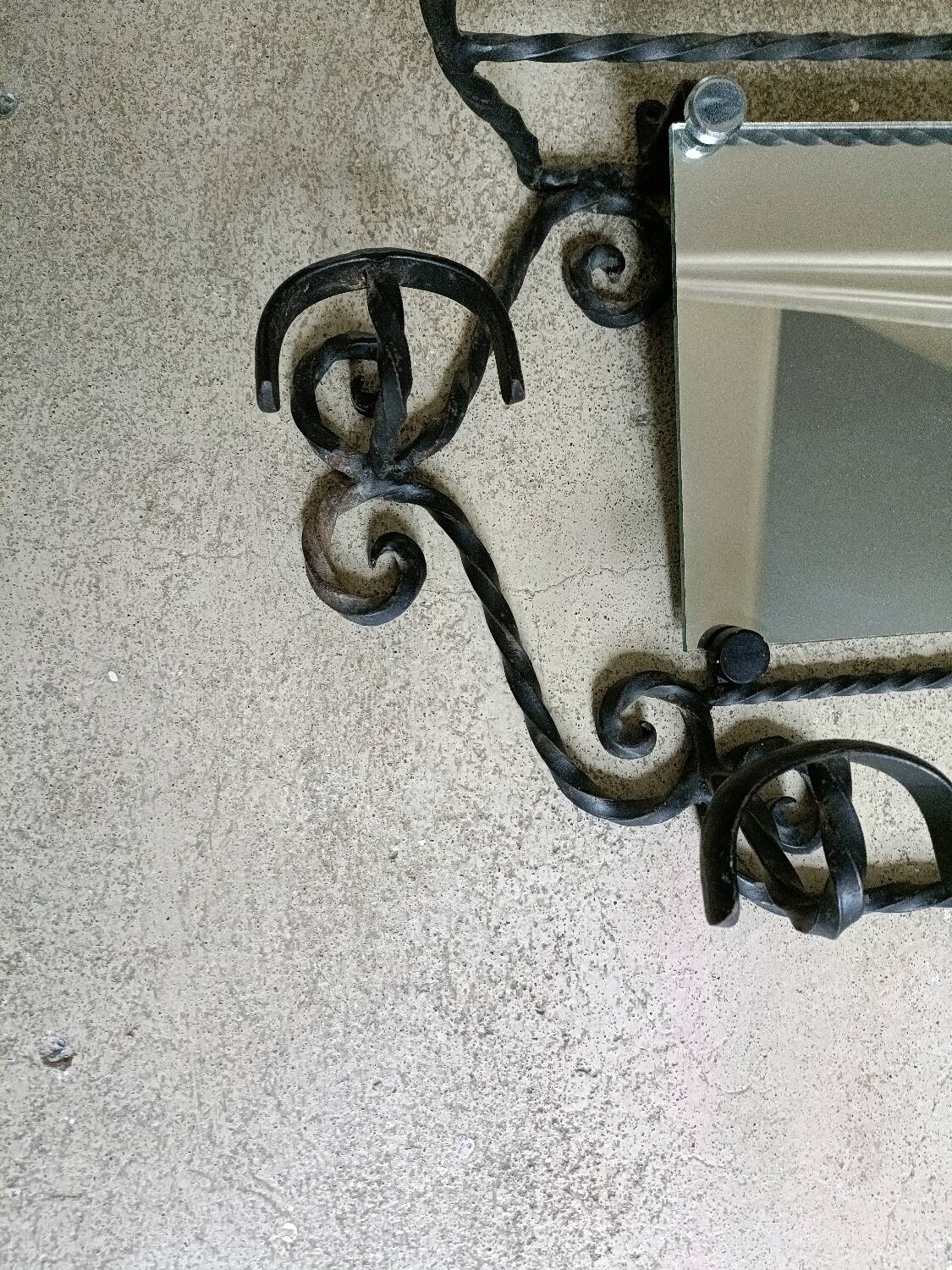 Twisted wrought iron wall-mounted coat rack