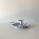 Candlestick in white enameled metal