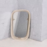 Luminous mirror in perforated sheet metal and brass