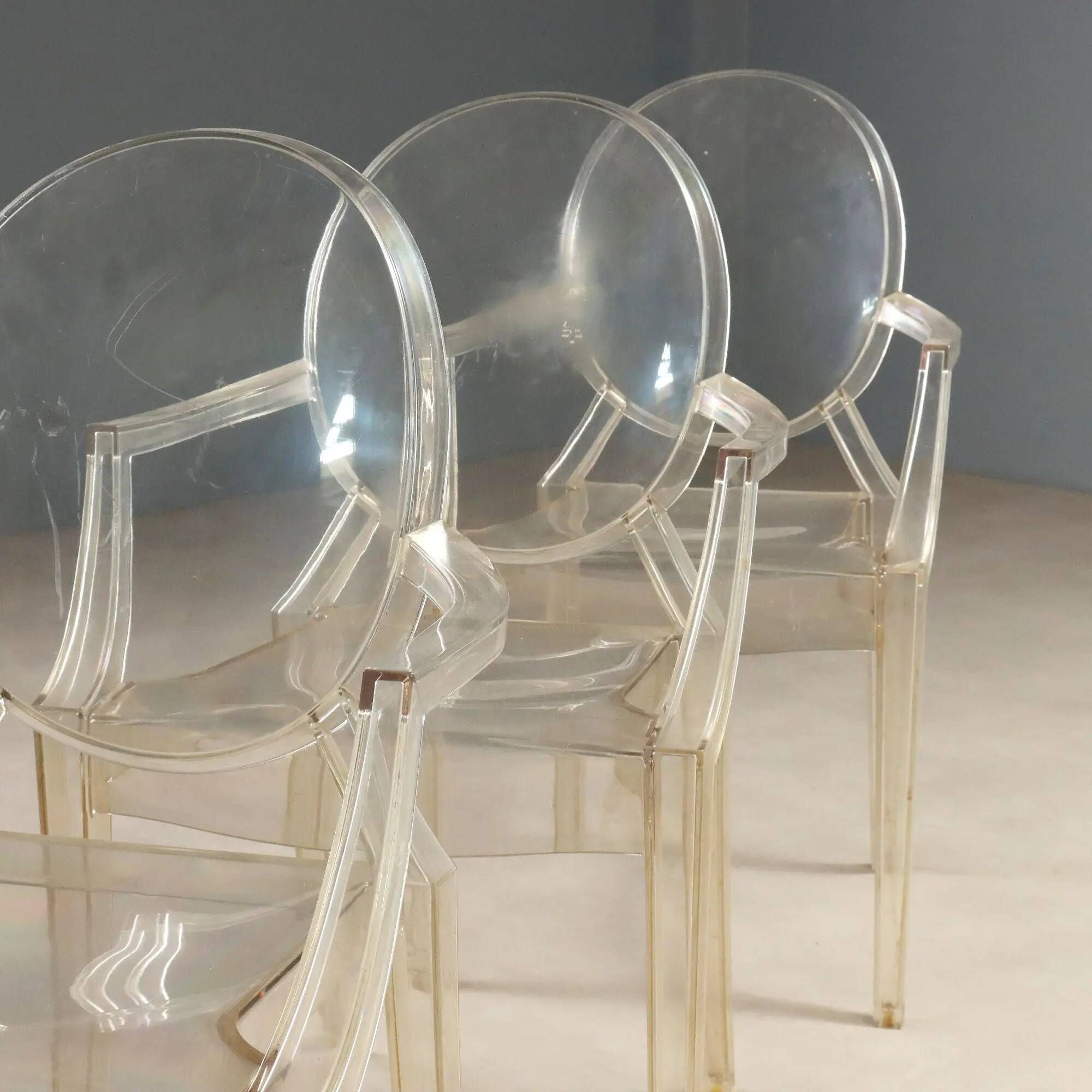 Louis Ghost chairs by Kartell designed by Philippe Starck from the 2000s.