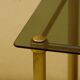 Antique brass serving trolley with smoked glass top, Louis XVI style.
