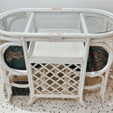 Rattan head-to-head table with vintage armchairs