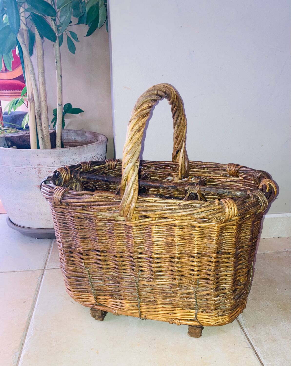 Wicker and hazel bottle basket from the early 20th century or possibly earlier.
