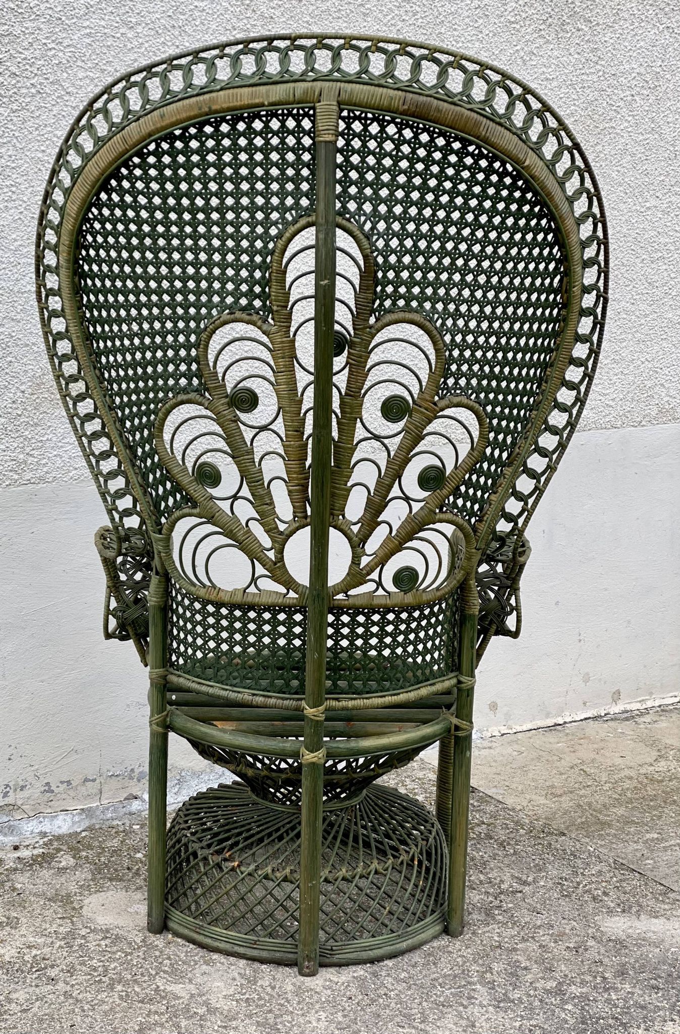 Vintage 1970s green patinated peacock rattan armchair