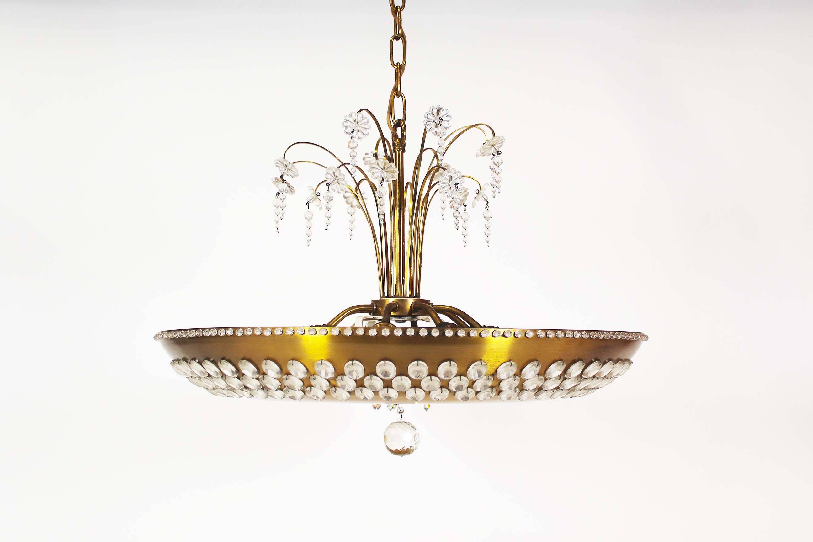 Monumental brass and crystal chandelier from Palwa